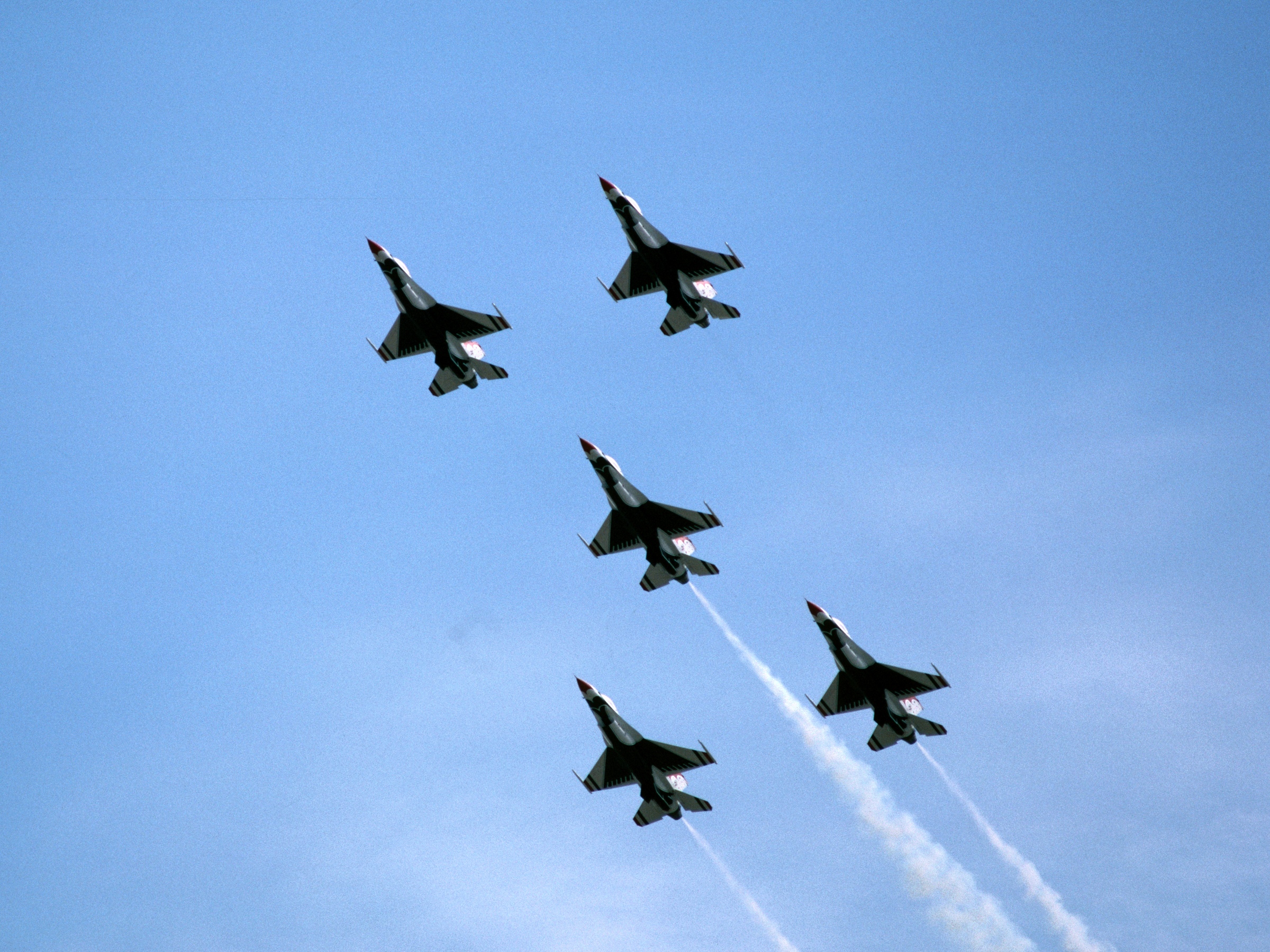 A photo of 5 fighter jets in the sky