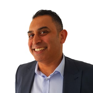 Binz in a suit with no background and no tie, Aaron Wallis Sales Recruitment